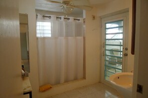 Shower, hair dryer, towels, toilet paper