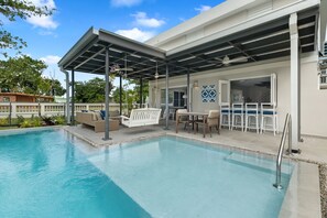 Outdoor pool, a heated pool - Your own beach house, private pool & pickle ball court, steps to beach. (Sabana, Vega Alta, Puerto Rico)