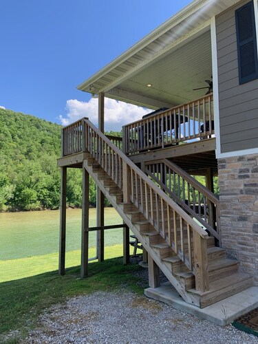 Private riverfront getaway with direct steps to fishing paradise.