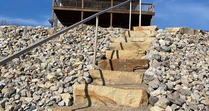 Private riverfront getaway with direct steps to fishing paradise.