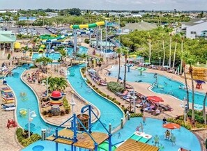 A water park with multiple pools, slides, and a large water slide structure. - YOUR WINTER GETAWAY! The Perfect Beach House! Less than a half-mile to the sand! (Indian Rocks Beach)