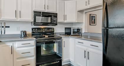Two-Level Condo w/ Mountain View, Wood Stove, WiFi, Laundry & Central Location