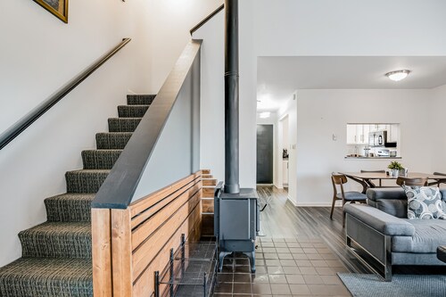 Two-Level Condo w/ Mountain View, Wood Stove, WiFi, Laundry & Central Location