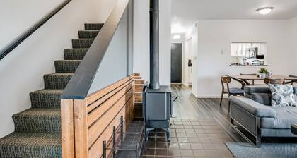 Two-Level Condo w/ Mountain View, Wood Stove, WiFi, Laundry & Central Location