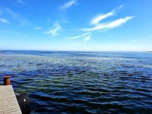 A wooden pier extending into a calm sea under a clear sky. - 6 Person Holiday Home in Hadsund (Hadsund)