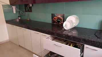 Fridge, stovetop, electric kettle, cookware/dishes/utensils