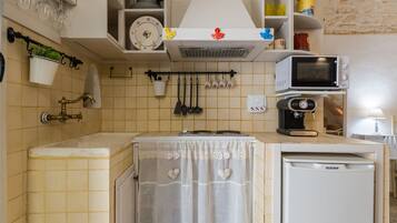 Apartment | Private kitchen | Full-size fridge, stovetop, cookware/dishes/utensils