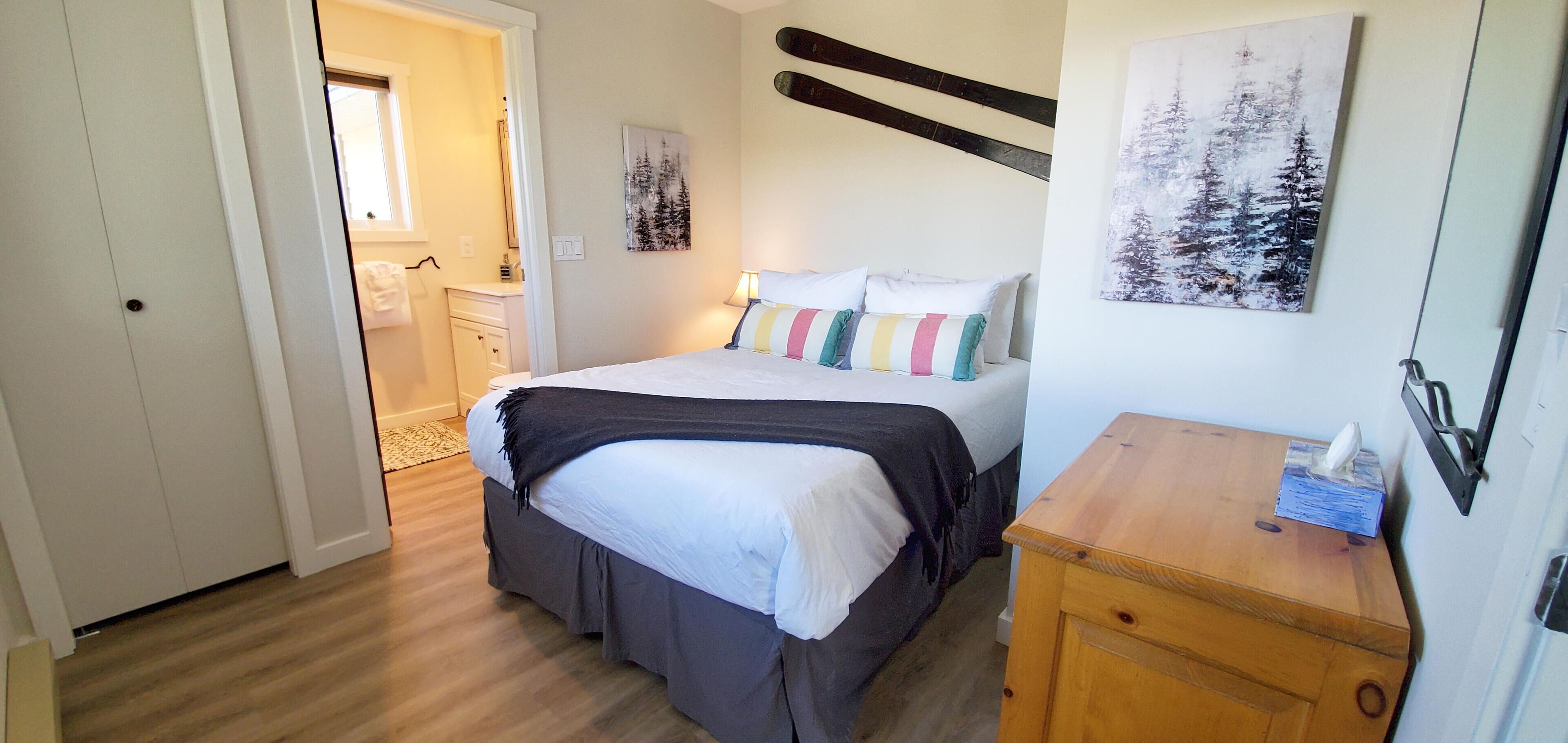 The second bedroom has a double bed and access to an ensuite.