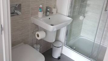 Apartment, 2 Queen Beds | Bathroom | Shower, hair dryer, towels