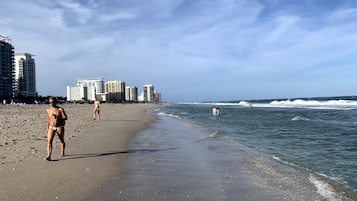 On the beach, sun loungers, beach towels