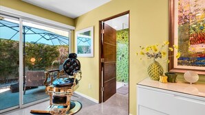 A modern bathroom with a glass shower, a golden bathtub, and a white vanity. - A Design-Forward Midcentury Residence in Central Palm Springs! (Palm Springs)