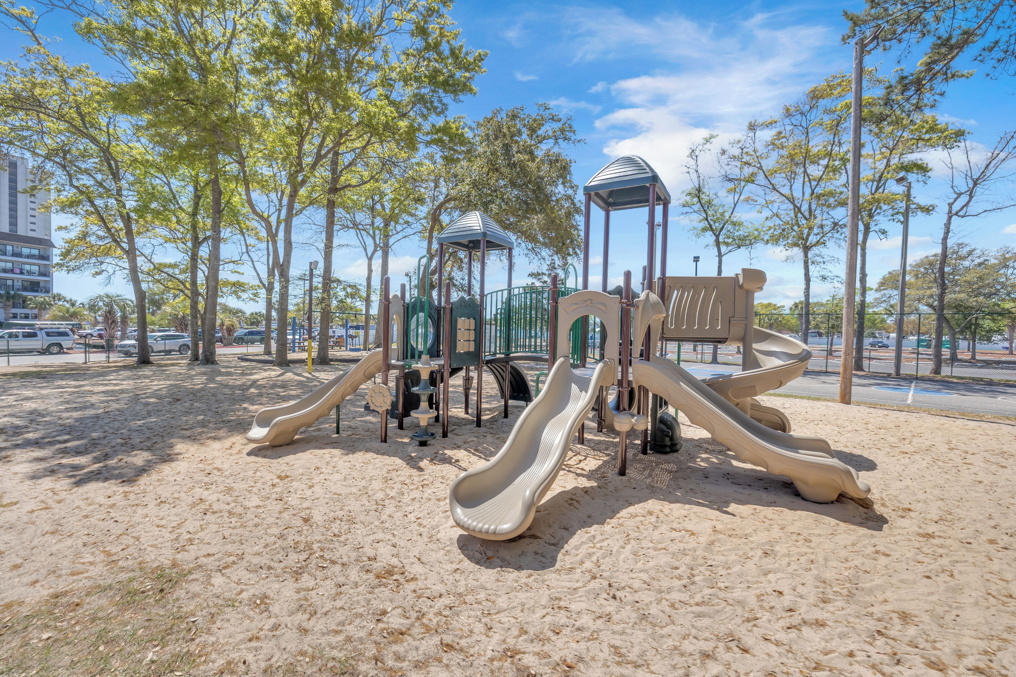 A playground with slides and climbing structures.