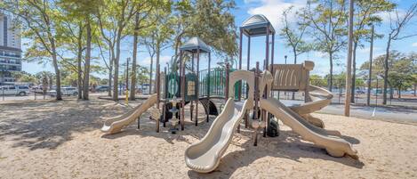A playground with slides and climbing structures.