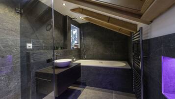 Bathtub, jetted tub, hair dryer, slippers