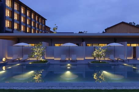 Outdoor pool, pool umbrellas. ROKU KYOTO, LXR Hotels & Resorts