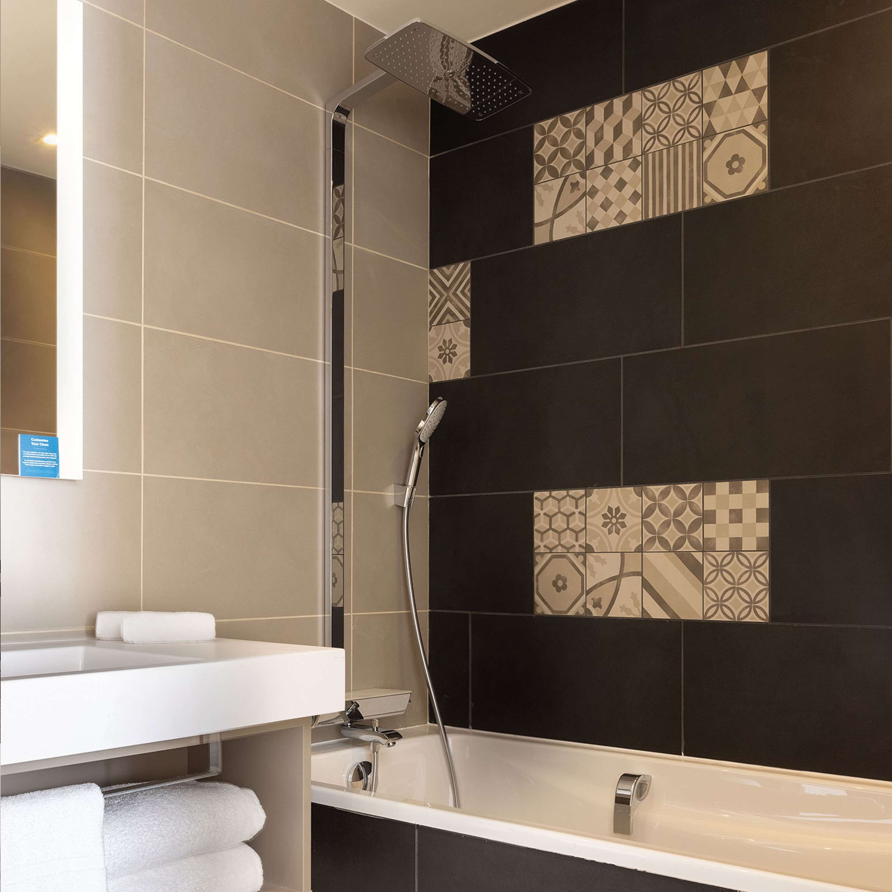 shower, hydromassage showerhead, hair dryer, towels