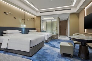 Hypo-allergenic bedding, down comforters, minibar, in-room safe