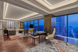 King Presidential Suite | Living area | 65-inch LCD TV with satellite channels, TV
