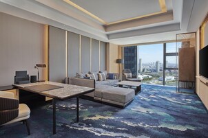King Deluxe Suite | Living area | 65-inch LCD TV with satellite channels, TV