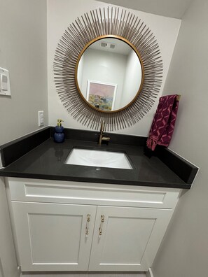 Bathtub, hair dryer, towels, soap