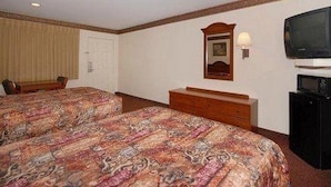 A hotel room with two beds, a television, a desk, and a dresser. - Red Roof Inn & Suites Houston Humble/iah Airport (Humble)