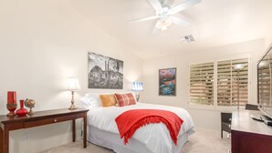 A bedroom with a bed, bedside tables, a ceiling fan, artwork, and a window with blinds. - Ahwatukee/Foothills-Golfer's Paradise! Desert Vacation Retreat/Gated Community! (Phoenix)
