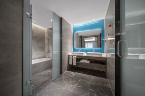 A modern bathroom with a glass shower enclosure, two sinks, and a large mirror. - Holiday Inn Express Yixing by IHG (Wuxi)
