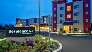 A multi-story hotel with a sign reading "Residence Inn by Marriott" and a landscaped entrance area. - Residence Inn by Marriott Reading (Wyomissing)