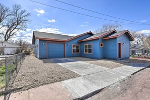 A two-story house with a blue exterior and a concrete driveway. - Modern Retreat: 3 Blocks to Dtwn Williams + Rte 66 (Williams)