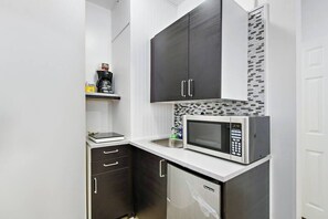 Mini-fridge, microwave, stovetop, coffee/tea maker