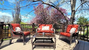 A deck with wicker furniture and a glass table. - $0Fees; Near Park, Dining; Easy Access to Downtown (Northglenn)