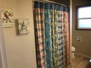 Bathtub, hair dryer, towels, soap