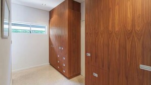 A room with a large wardrobe, a window, and a door. - Breezy Bay Retreat: Family Haven near Town & Beach (Dunsborough)