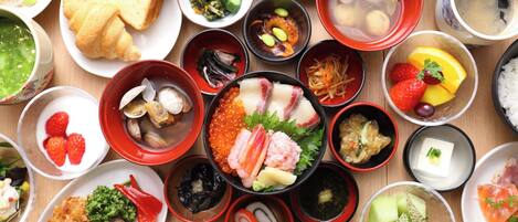 A variety of Japanese dishes arranged on a wooden table.