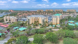 A resort with multiple buildings, a marina, and a view of the ocean. - Your Waterfront Retreat at Burnt Store Marina (Punta Gorda)