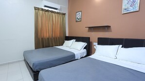 A hotel room with two beds, a window with curtains, an air conditioning unit, and a wall-mounted shelf. - OYO HOME 90244 Dkeris 2bhk Apartment (Malacca City)