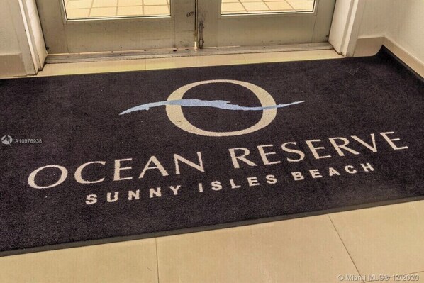 A doormat with the text "Ocean Reserve Sunny Isles Beach" and a logo.