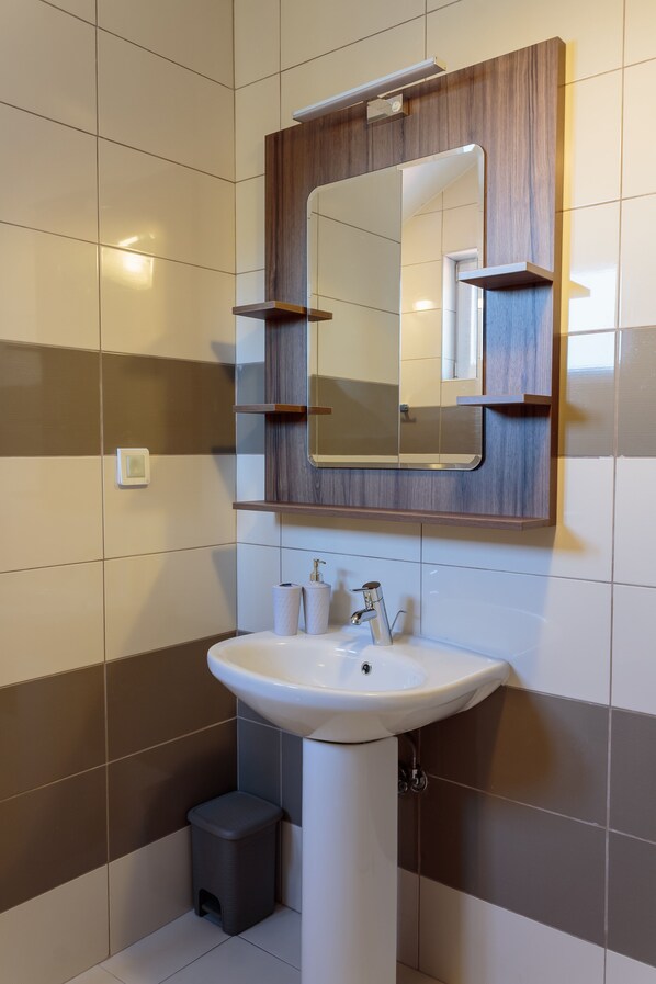 Bathtub, hair dryer, towels, soap
