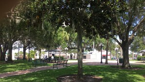 A park with benches, a walking path, and trees. - Historic Section of Sebring  Townhome (Sebring)