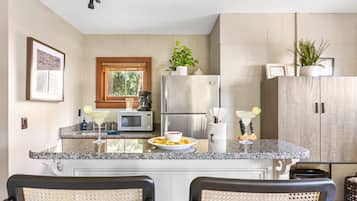 Fridge, microwave, stovetop, coffee/tea maker
