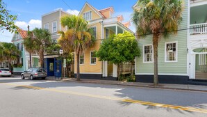 A row of colorful houses with a street in front. - 3 Blocks to King, Historic Home | The Garden Gates (Charleston)