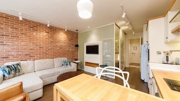 Apartment, 1 Bedroom | Living area | 32-inch Smart TV with satellite channels, TV, Netflix