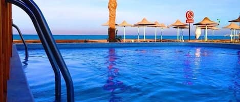 11 outdoor pools, open 9:00 AM to 5:00 PM, pool umbrellas, sun loungers