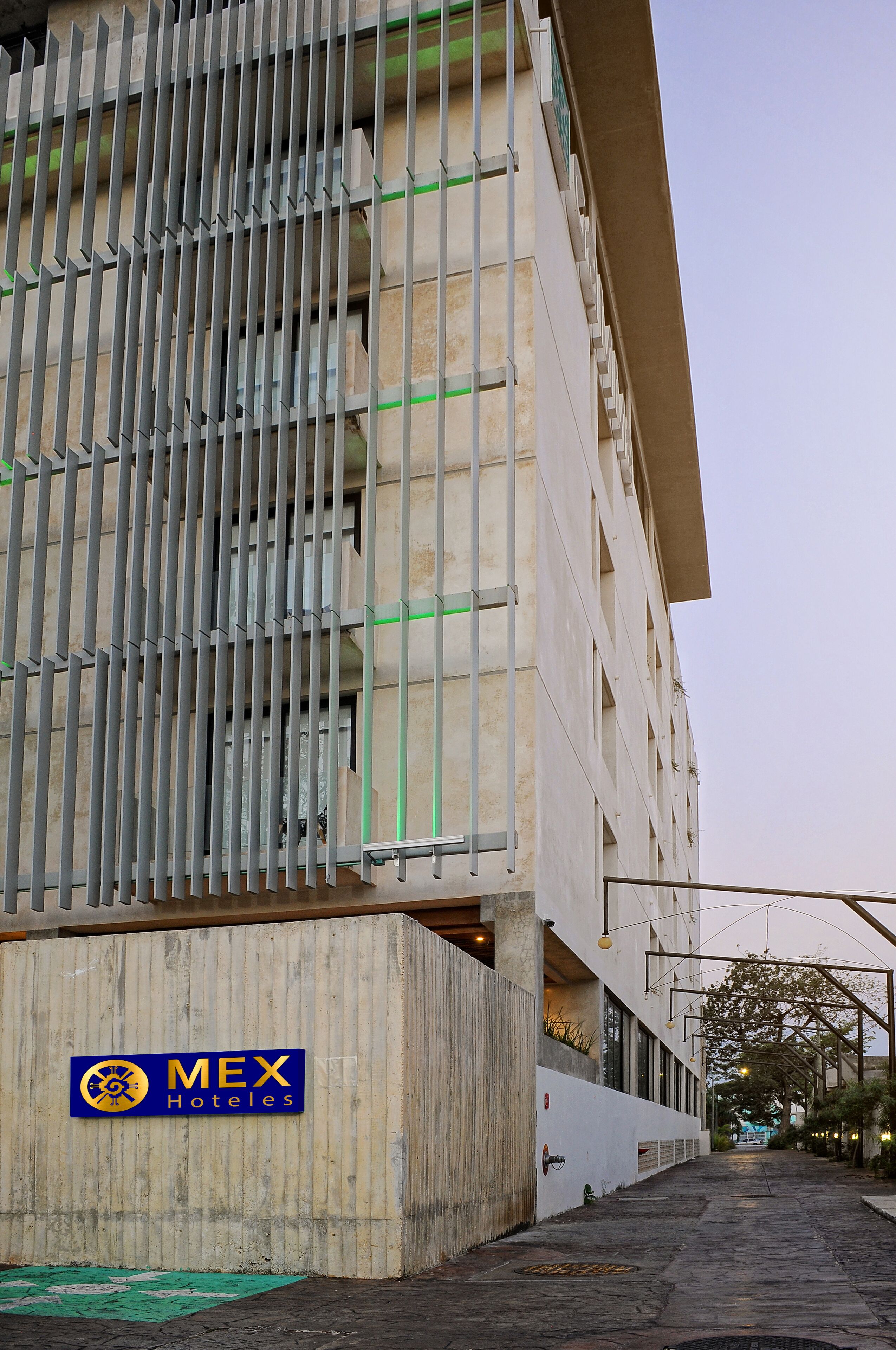 A building with a sign for "MEX Hoteles" indicating a hotel.