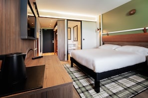 Premium bedding, pillow-top beds, desk, laptop workspace