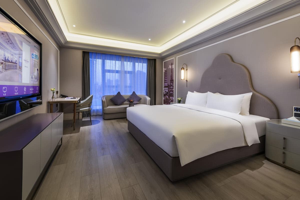 Quarto luxo, 1 cama King | Frigobar, Wi-Fi de cortesia