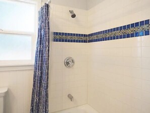 Combined shower/tub, hair dryer, towels, soap