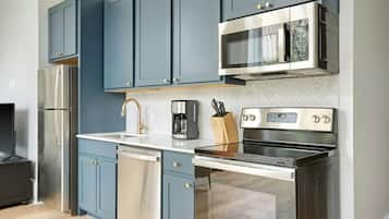 Three-Bedroom Suite | Private kitchen | Fridge, microwave, oven, stovetop