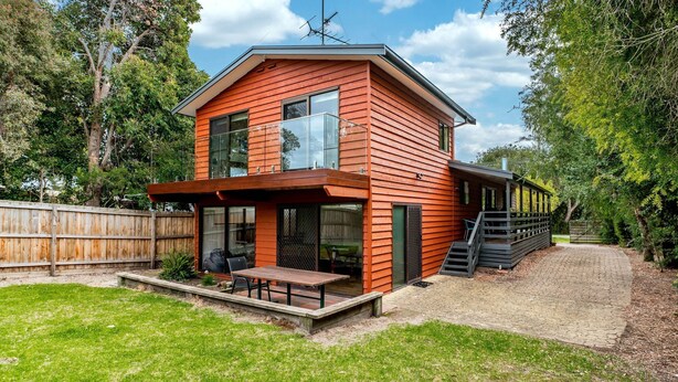 A modern two-story house with a covered patio and a staircase leading to the upper level. - WAVELENGTH - Free Wifi and Pet Friendly (outside only) (Inverloch)