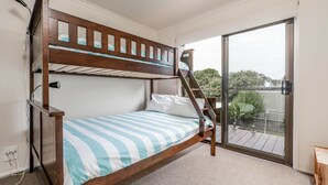 A bunk bed room with a view of the outdoors through a sliding glass door. - WAVELENGTH - Free Wifi and Pet Friendly (outside only) (Inverloch)